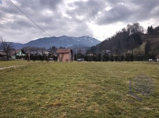 A spacious plot of land with an area of 2,359m2 on flat terrain and a beautiful natural environment with a mountain stream in the settlement of Pazarić, Hadžići